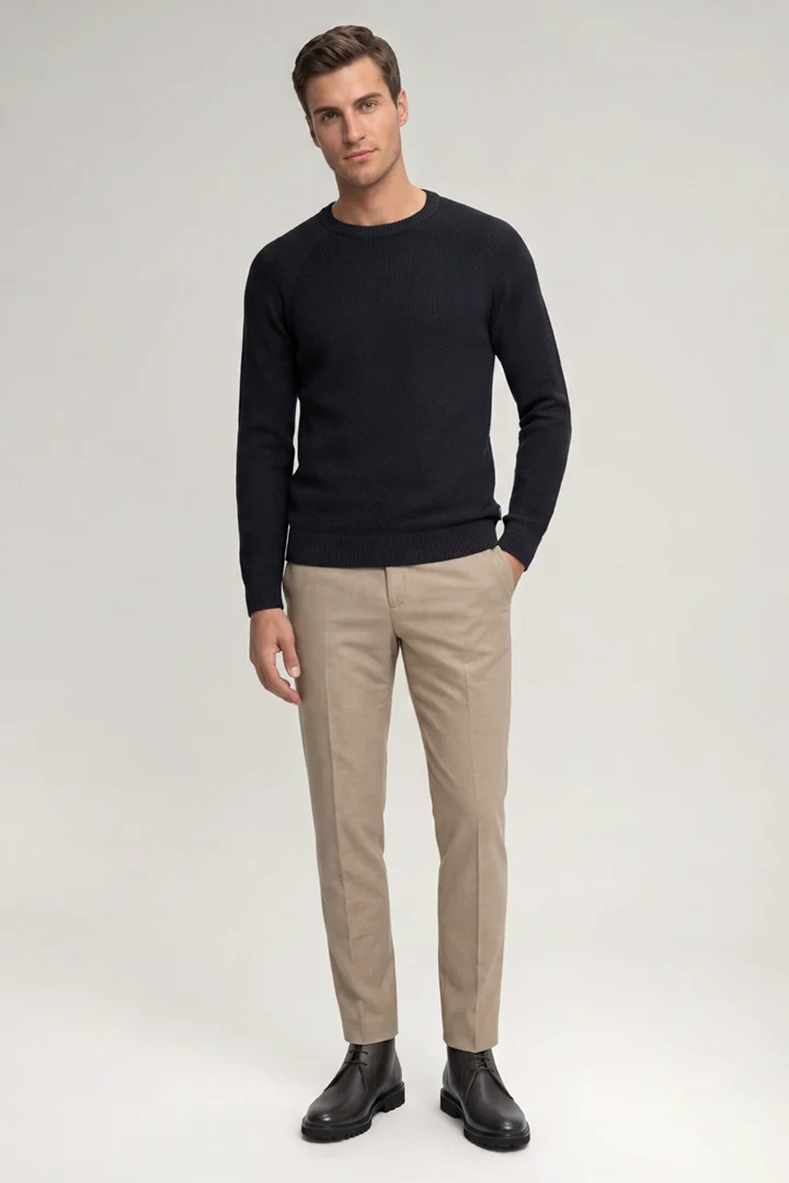 Leads to product detail page "Navy cotton crew-neck jumper"