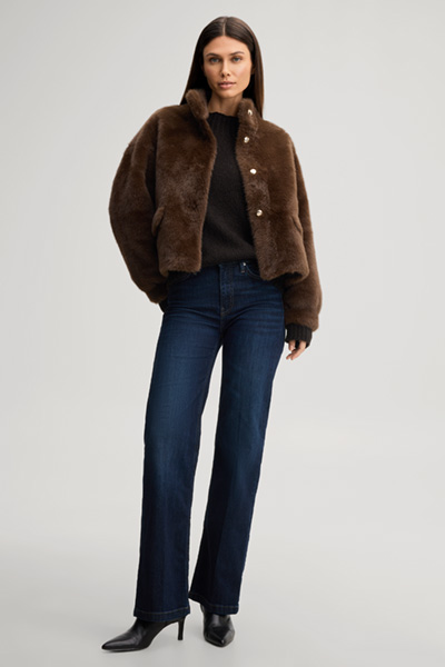 Leads to product detail page "Faux fur jacket with a stand-up collar in dark brown"