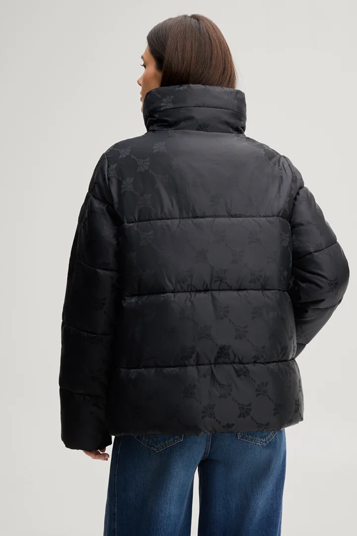 Führt zu Produktdetailseite „Cornflower-Steppjacke in Schwarz gemustert"