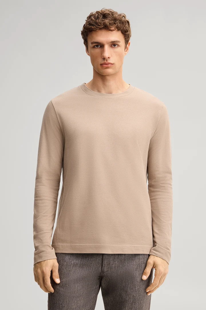 Leads to product detail page "Brown cotton longsleeve top"