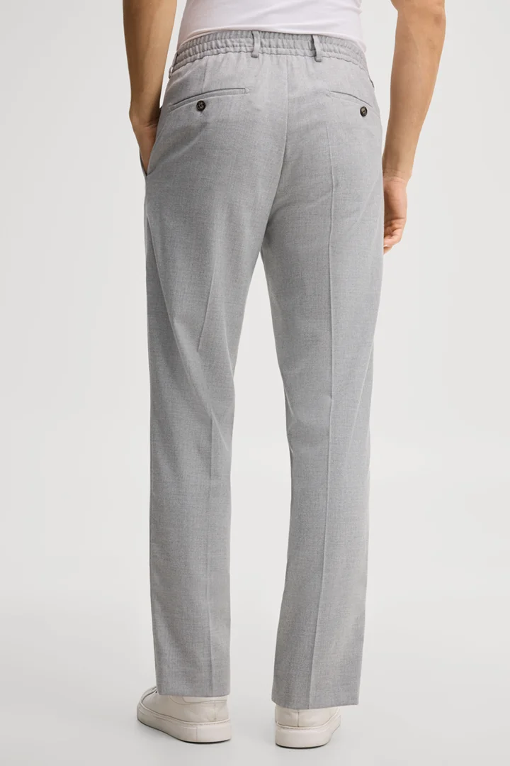 Leads to product detail page "Light grey suit trousers"