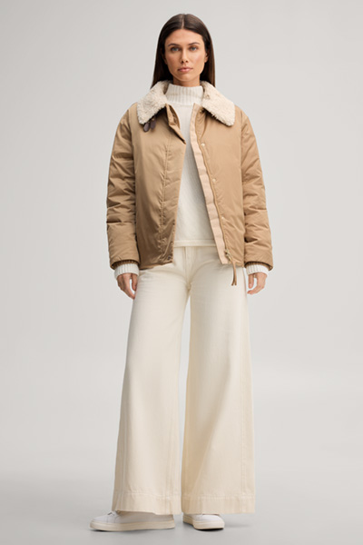 Leads to product detail page "Camel-coloured pilot jacket with teddy collar"