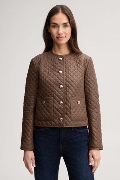 Leads to product detail page "Light brown quilted leather jacket"