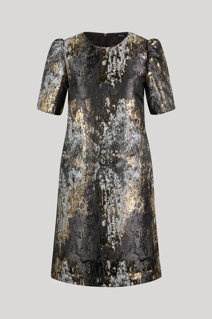 Leads to product detail page "Dress with puff sleeves in black, gold and silver pattern"