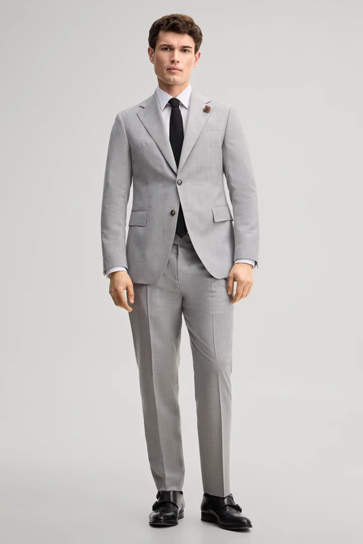 Leads to product detail page "Modular suit jacket in grey, made from virgin wool"