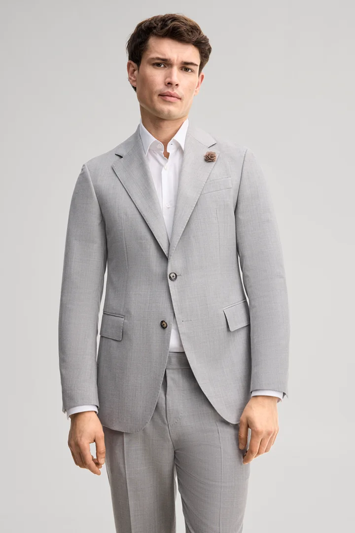 Leads to product detail page "Modular suit jacket in grey, made from virgin wool"