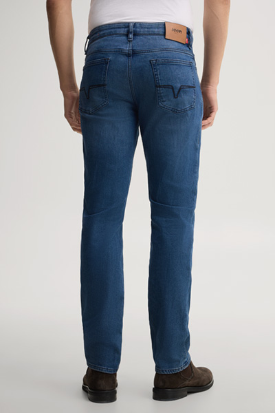 Leads to product detail page "Blue stretch five-pocket jeans"