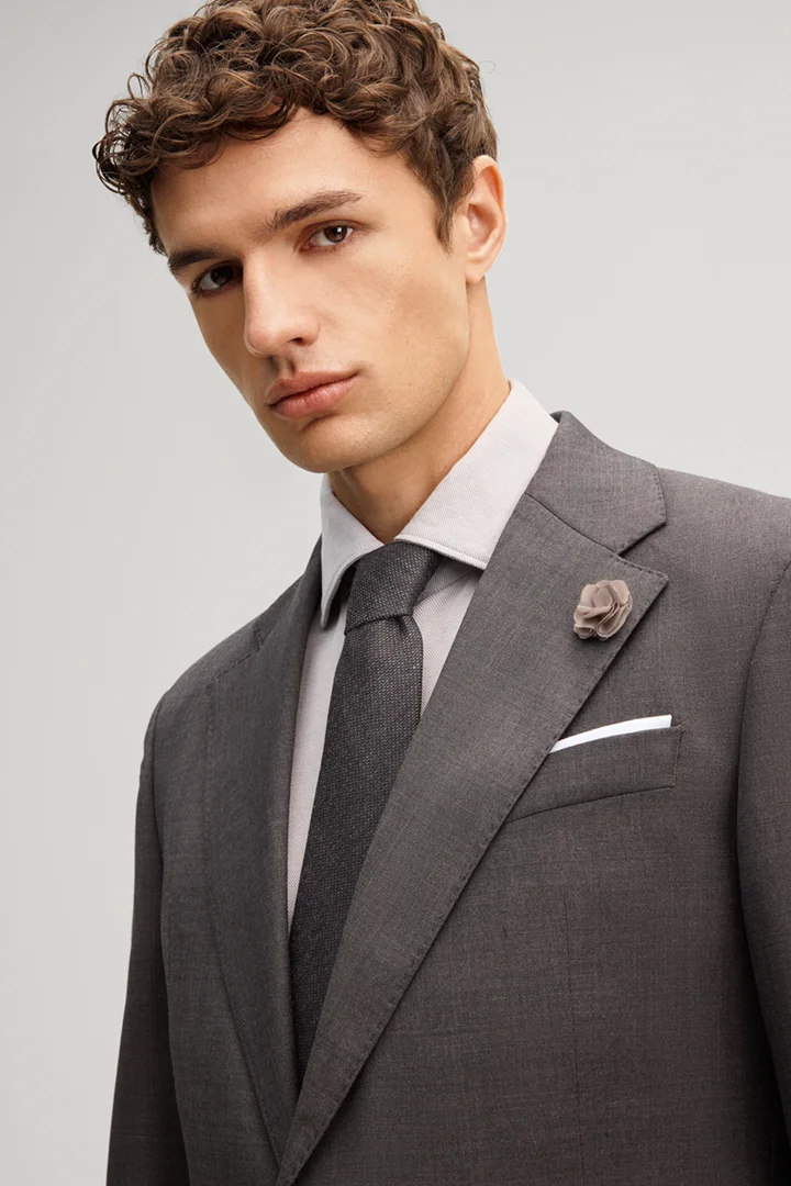 Leads to product detail page "Dark brown wool-blend suit"