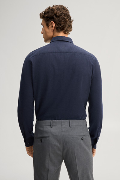 Leads to product detail page "Navy cotton shirt"