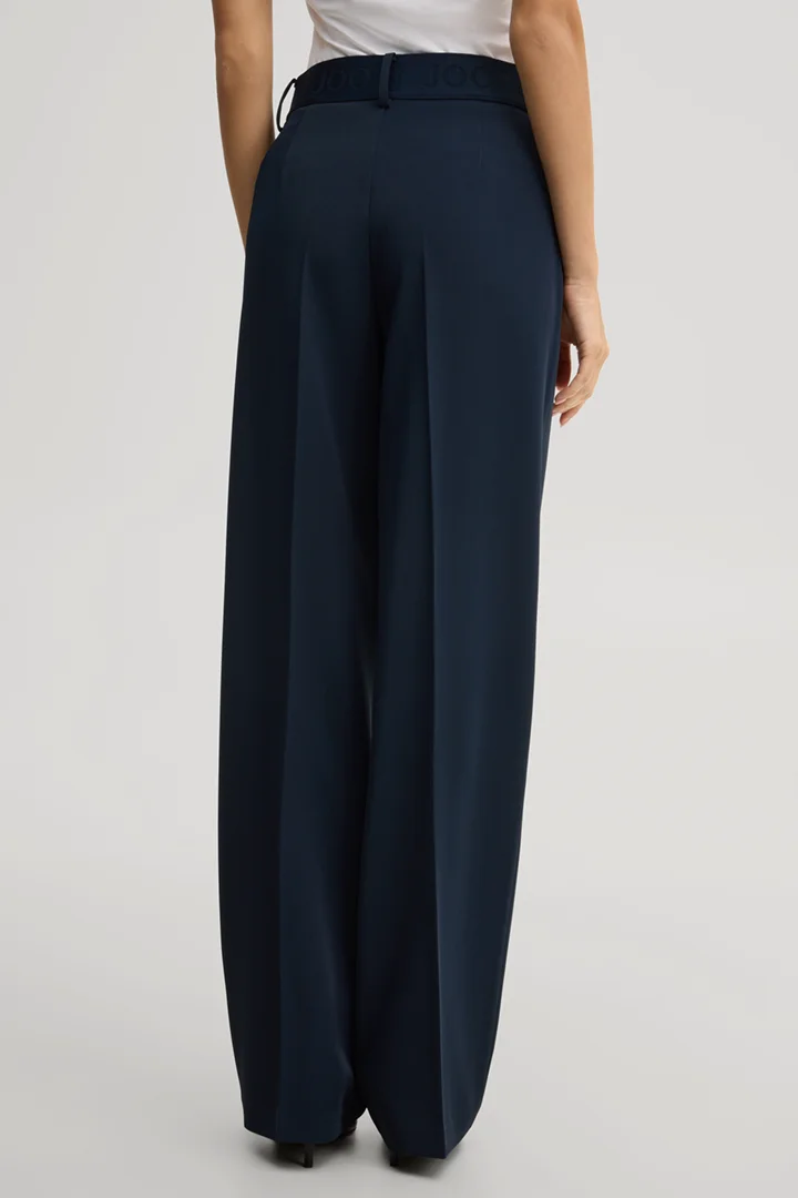 Leads to product detail page "Travel marlene trousers in navy"