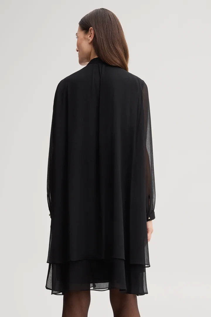 Leads to product detail page "Black chiffon dress with a bow tie"