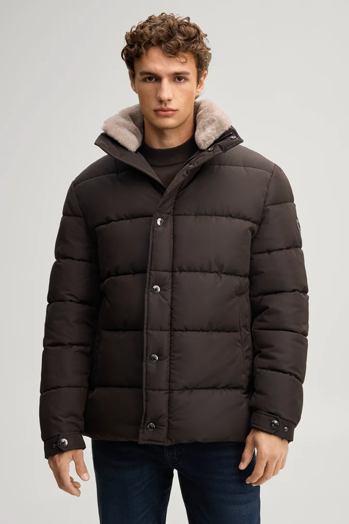 Leads to product detail page "Quilted jacket with a lined stand-up collar in dark brown"
