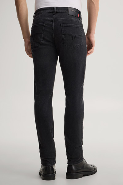 Leads to product detail page "Black stretch five-pocket jeans"