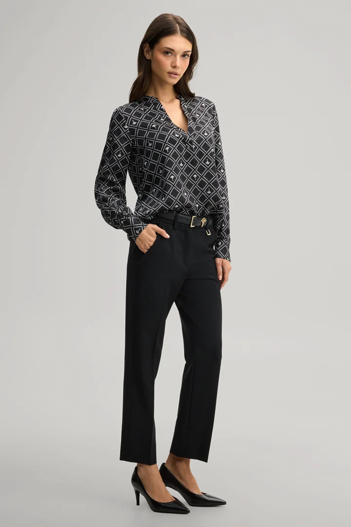 Leads to product detail page "Cornflower blouse in black and ecru pattern"