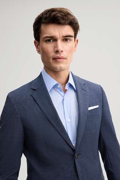 Leads to product detail page "Medium blue wool-blend suit"