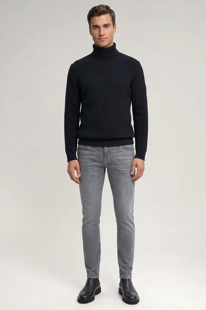 Leads to product detail page "Dark blue roll-neck jumper"