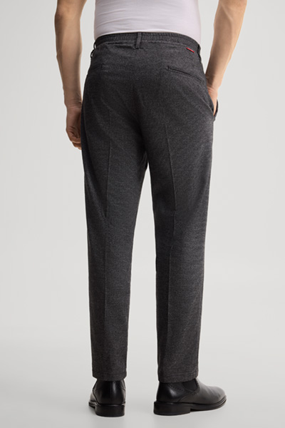 Leads to product detail page "Cotton-blend pleated trousers in anthracite"