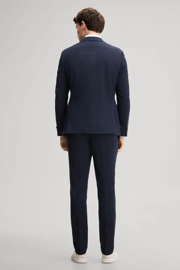 Leads to product detail page "Navy wool-blend suit"