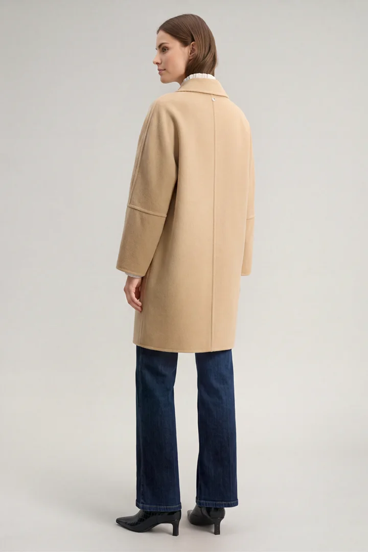 Leads to product detail page "Light beige wool-blend coat"