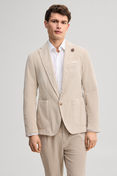 Leads to product detail page "Light beige corduroy suit jacket"