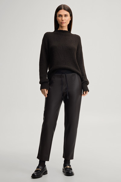 Leads to product detail page "Faux leather cigarette trousers in dark brown"
