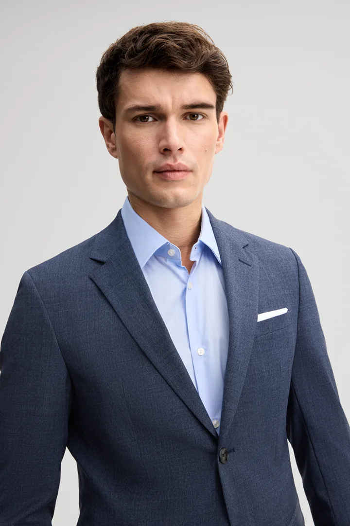 Leads to product detail page "Medium blue wool-blend suit"