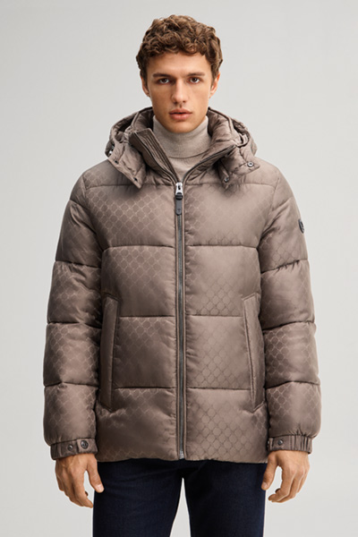 Leads to product detail page "Cornflower-patterned quilted jacket in taupe"