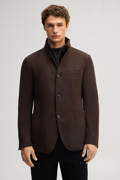 Leads to product detail page "Dark brown suit jacket with a stand-up collar"