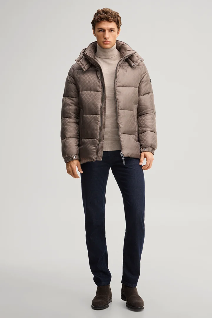 Leads to product detail page "Cornflower-patterned quilted jacket in taupe"