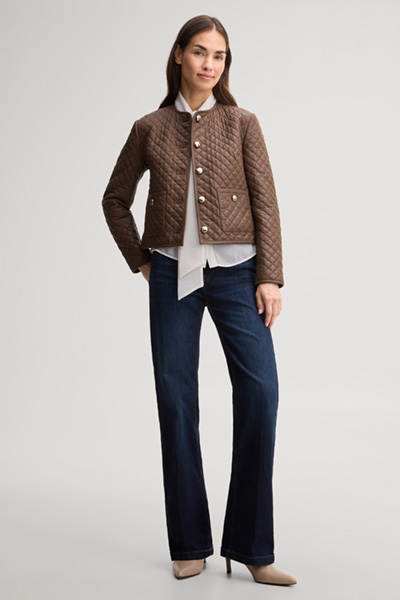 Leads to product detail page "Light brown quilted leather jacket"