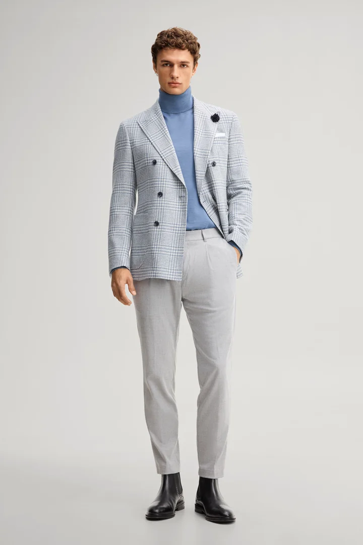 Leads to product detail page "Double-breasted suit jacket in a wool blend with a medium blue checked pattern"