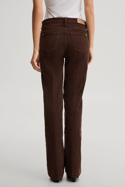 Leads to product detail page "Fine-cord jeans in dark brown"