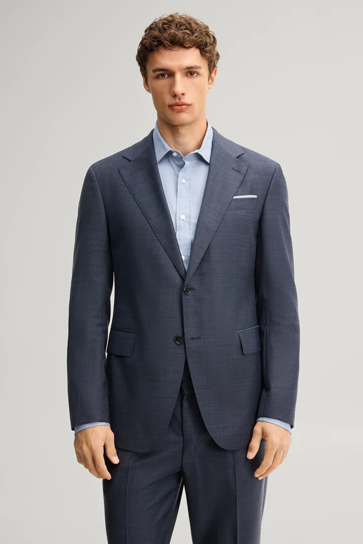 Leads to product detail page "Modular suit jacket in navy, made from virgin wool"