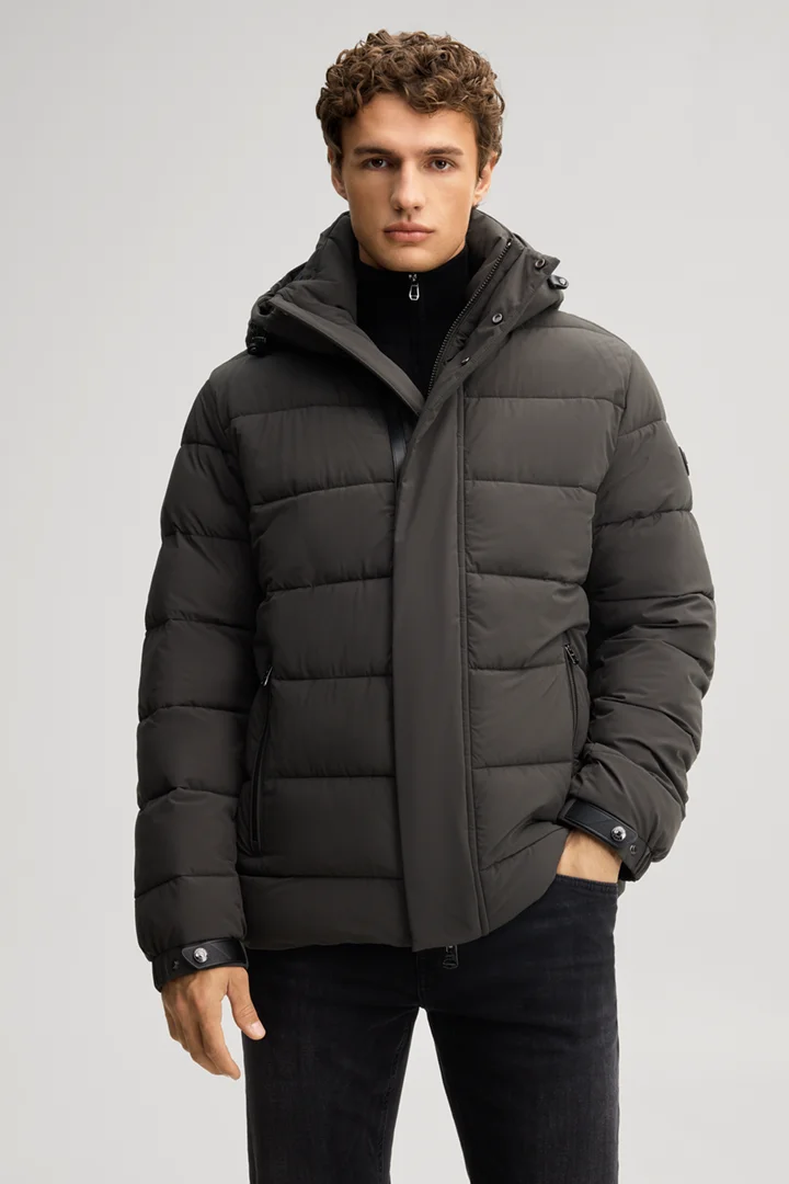 Leads to product detail page "Quilted jacket in dark green"