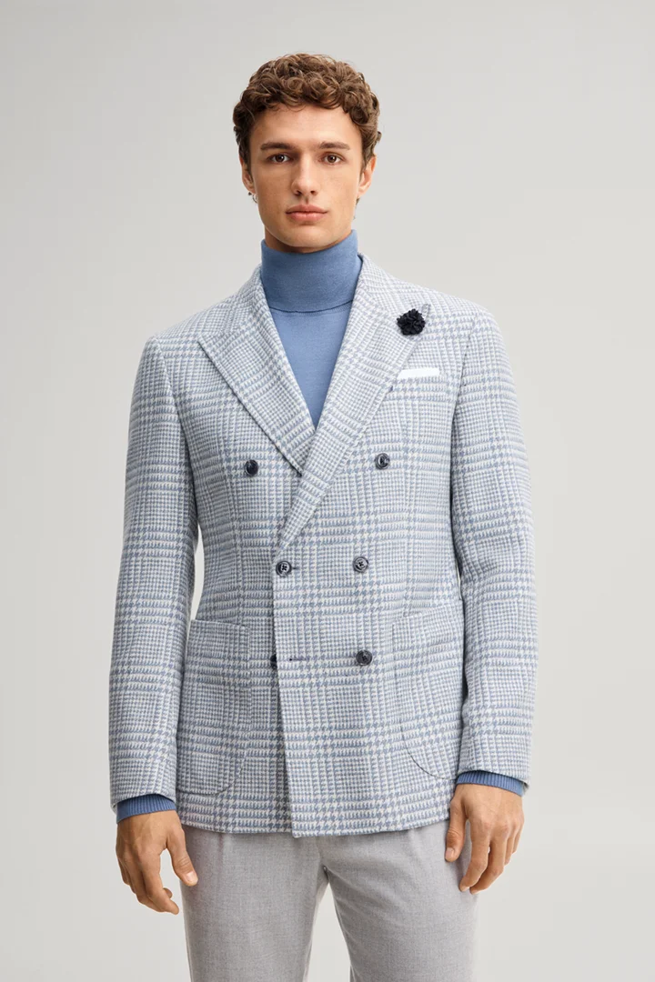 Leads to product detail page "Double-breasted suit jacket in a wool blend with a medium blue checked pattern"