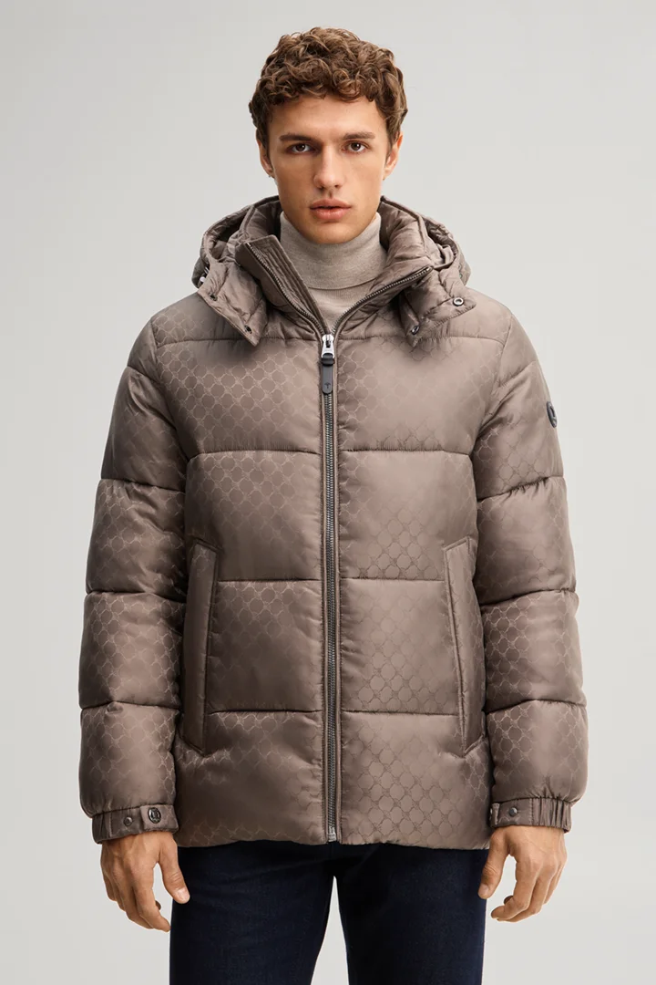 Leads to product detail page "Cornflower-patterned quilted jacket in taupe"