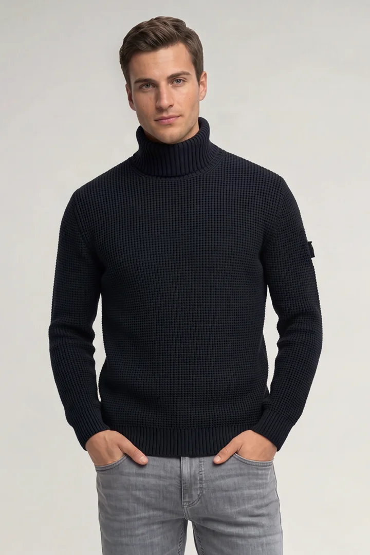 Leads to product detail page "Dark blue roll-neck jumper"