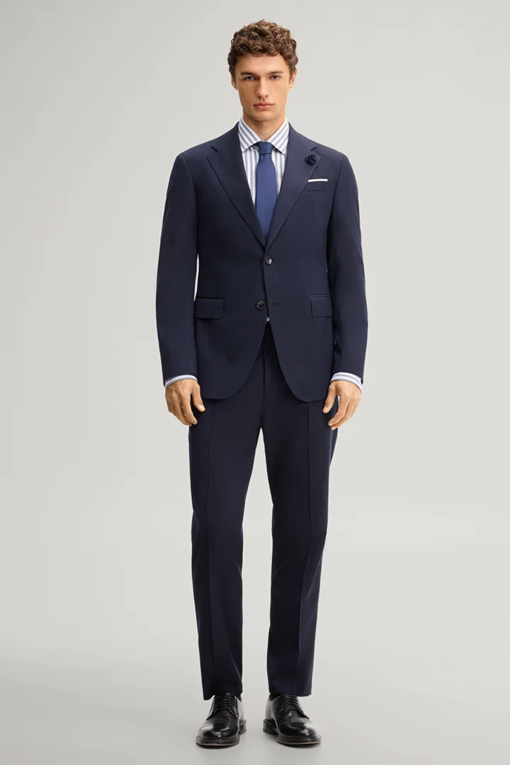 Leads to product detail page "Navy wool-blend suit"