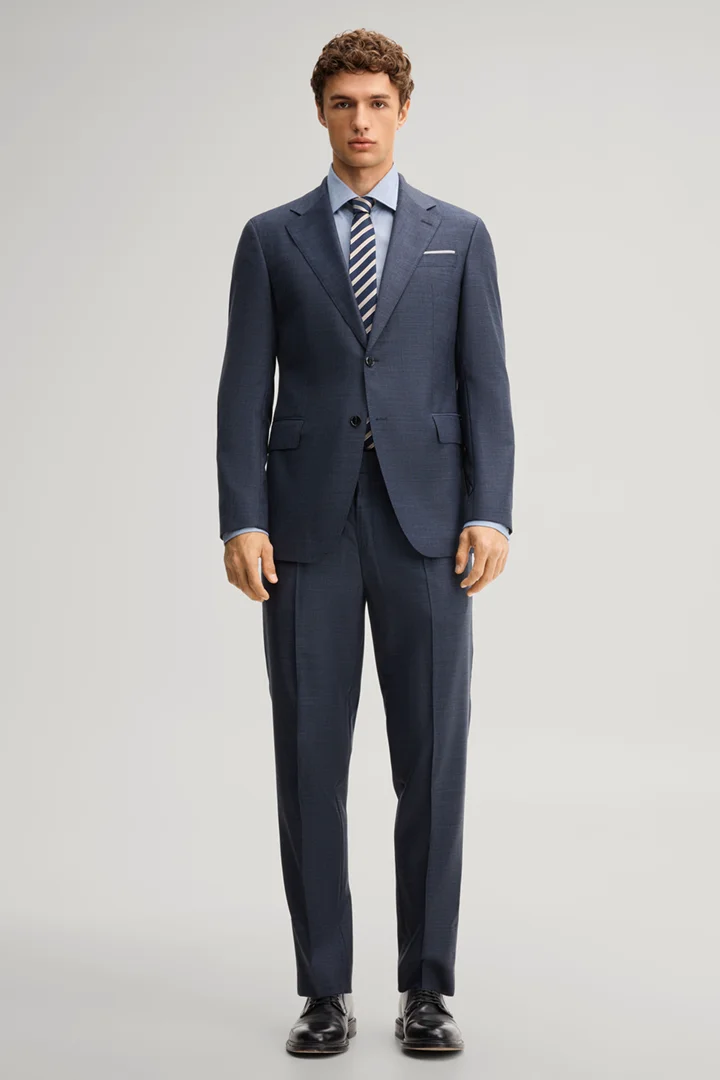 Leads to product detail page "Modular trousers in navy, made from virgin wool"