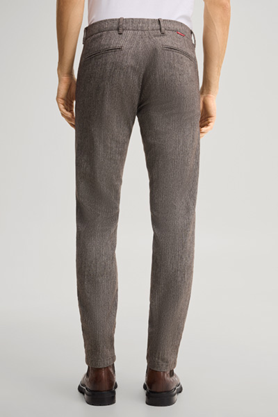 Leads to product detail page "Dark brown chino trousers"