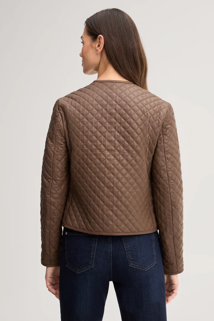 Leads to product detail page "Light brown quilted leather jacket"
