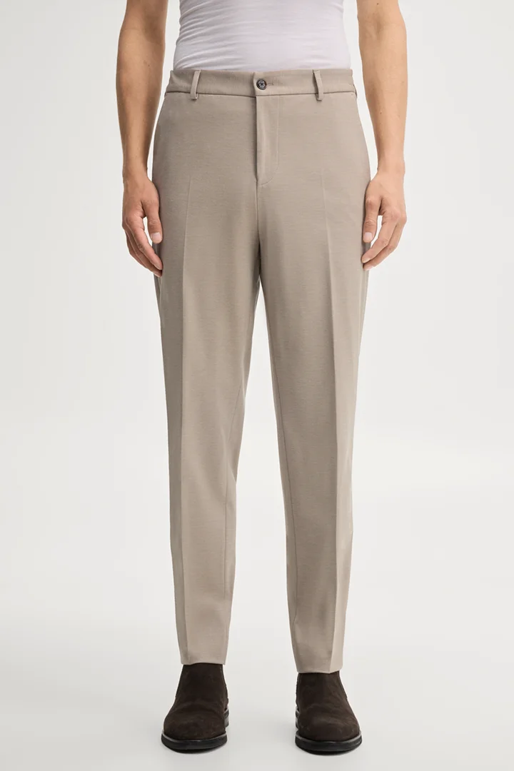 Leads to product detail page "Modular trousers in beige"