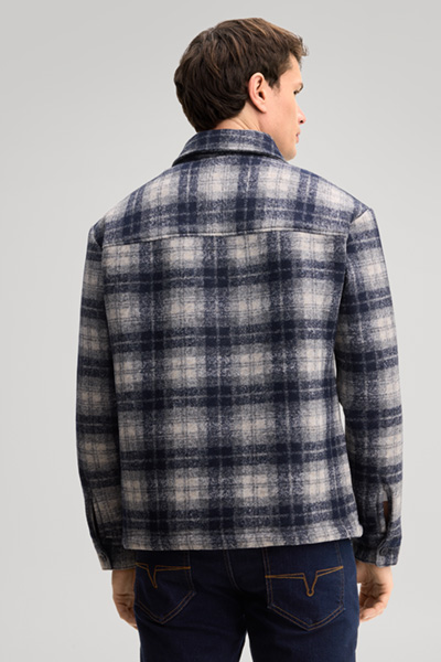 Leads to product detail page "Navy checked shirt jacket in a virgin wool blend"