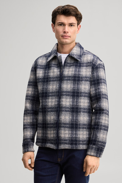 Leads to product detail page "Navy checked shirt jacket in a virgin wool blend"
