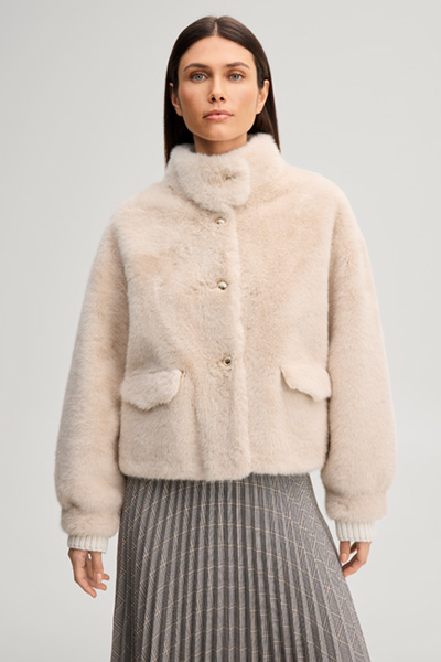 Leads to product detail page "Faux fur jacket with a stand-up collar in ecru"