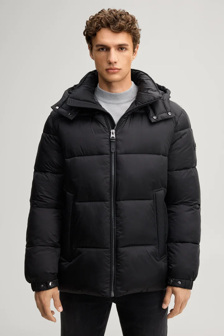 Leads to product detail page "Black hooded quilted jacket"