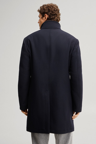 Leads to product detail page "Dark blue wool-blend coat with a stand-up collar"