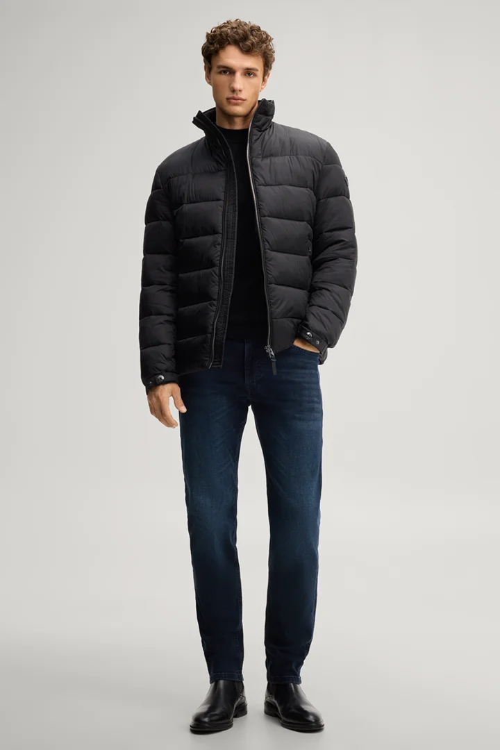 Leads to product detail page "Black quilted jacket with a stand-up collar"