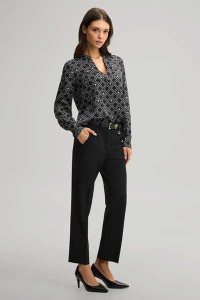 Leads to product detail page "Cornflower blouse in black and ecru pattern"
