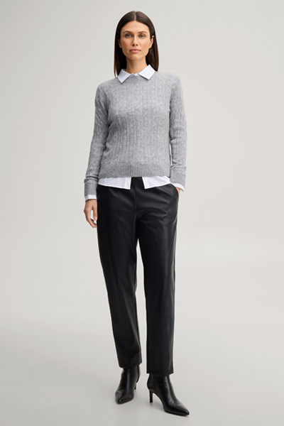 Leads to product detail page "Faux leather cigarette trousers in black"